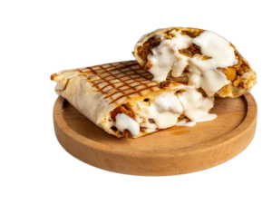 Tacos L’insomniaque Poulet mariné Cordon bleu Cheddar, sauce fromagère